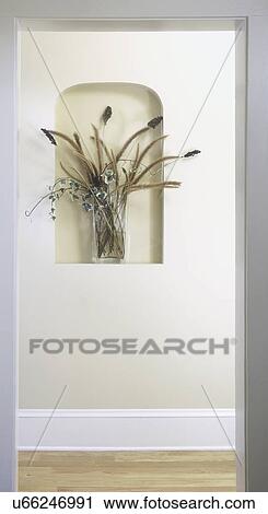ARCHITECTURAL DETAIL: small niche in wall holds vase of flowers, hallway and doorway View Large Photo Image Stock Image - ARCHITECTURAL DETAIL: small niche in wall holds vase of flowers, hallway and doorway. Fotosearch
