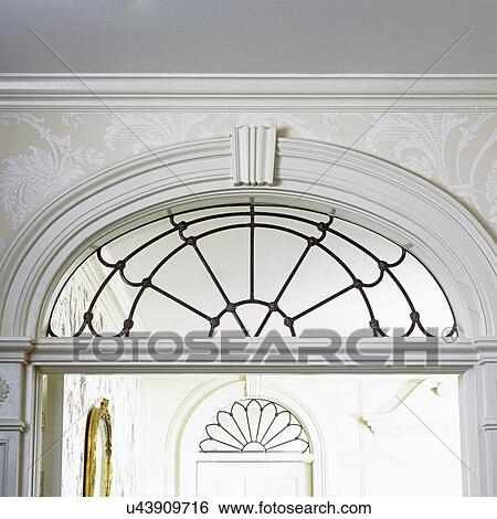 ARCHITECTURAL DETAILS: Transoms above door, leaded glass, white elaborate trim, Georgian Revival. View Large Photo Image Stock Photograph - ARCHITECTURAL DETAILS: Transoms above door, leaded glass, white elaborate trim, Georgian Revival.. Fotosearch