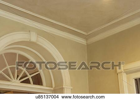 Picture - ARCHITECTURAL TRIM: crown molding, Georgian style, interior palladian window used like a transom for extra light,. Fotosearch