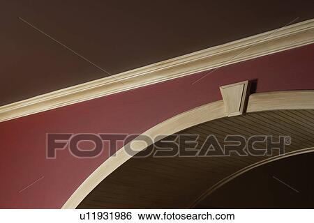 ARCHITECTURAL TRIM: dark brown painted ceiling, red walls, light stained trim, arched doorway View Large Photo Image Stock Photograph - ARCHITECTURAL TRIM: dark brown painted ceiling, red walls, light stained trim, arched doorway. Fotosearch