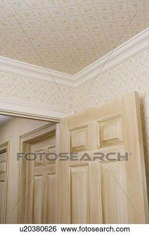 Architectural Trim Small Pattern Wallpaper On Walls And Ceiling White Crown Molding Separates Stock Photograph