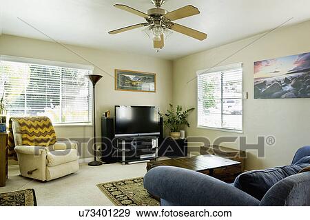 Armchair and entertainment center in living room View Large Photo Image Stock Photo - Armchair and entertainment center in living room. Fotosearch