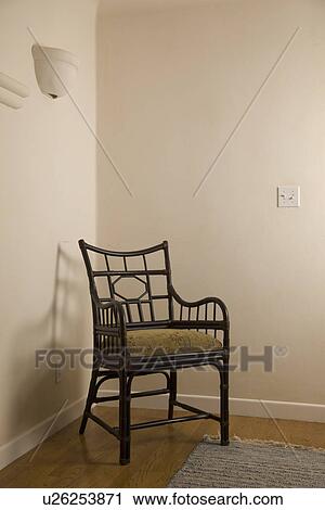 Stock Image - Armchair in corner; Carpinteria; California; USA. Fotosearch