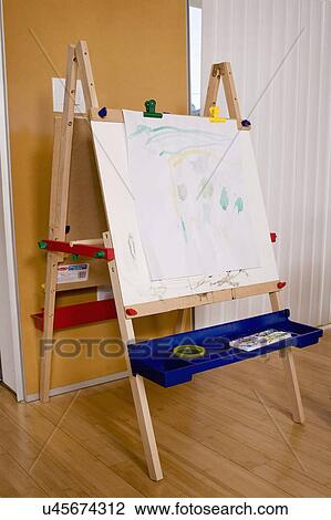 Stock Image - Artist's canvas on hardwood floor in domestic room, San Diego, California, USA. Fotosearch