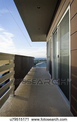 Stock Image - Balcony along second story of home, San Diego, California, USA. Fotosearch