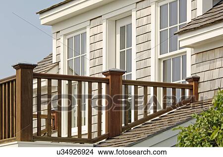 Picture - Balcony railing of single family home. Fotosearch