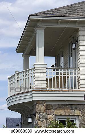 Balcony with white railing in single family home View Large Photo Image Stock Photo - Balcony with white railing in single family home. Fotosearch