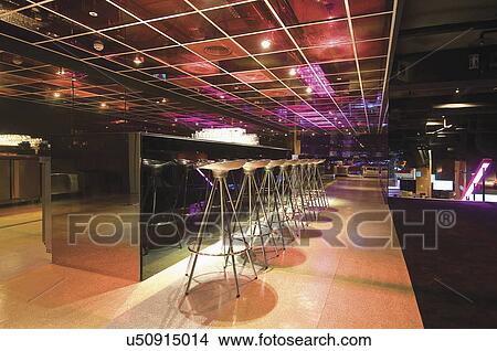 Bar counter with stools in modern nightclub View Large Photo Image Picture - Bar counter with stools in modern nightclub. Fotosearch