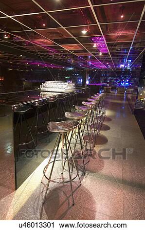 Bar counter with stools in modern nightclub View Large Photo Image Stock Image - Bar counter with stools in modern nightclub. Fotosearch
