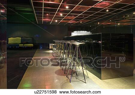 Stock Photo - Bar stools at nightclub. Fotosearch