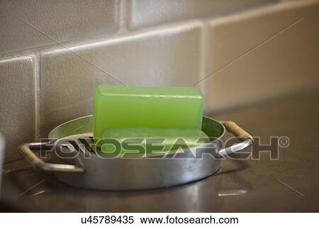 Stock Photography - Bars of soap in front of tile backsplash; Irvine; California; USA. Fotosearch
