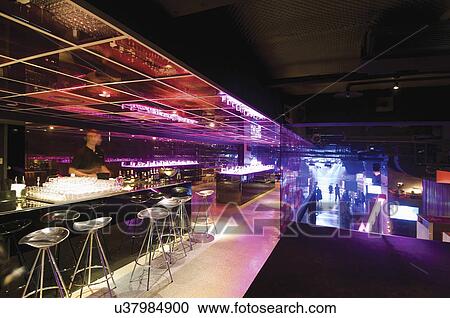 Bartender at bar in nightclub View Large Photo Image Stock Image - Bartender at bar in nightclub. Fotosearch