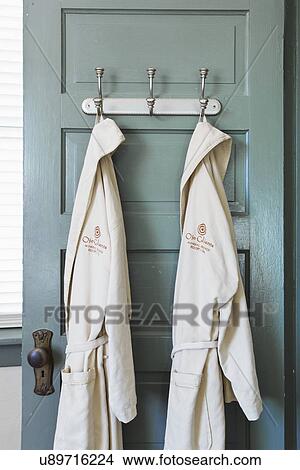 Bathrobes hanging on hooks on door, Ojo Caliente, New Mexico, USA View Large Photo Image Picture - Bathrobes hanging on hooks on door, Ojo Caliente, New Mexico, USA. Fotosearch