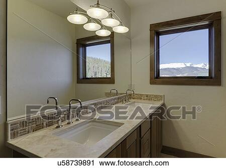 Stock Image - Bathroom counter with mosaic tile backsplash. Fotosearch