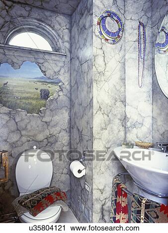 BATHROOMS: Detail of Trompe l'oeil painting on bathroom wall with Africa landscape over white toilet of left. View of part of sink bowl on the right. Red, green, beige patterned towels. View Large Photo Image Stock Image - BATHROOMS: Detail of Trompe l'oeil painting on bathroom wall with Africa landscape over white toilet of left. View of part of sink bowl on the right. Red, green, beige patterned towels.. Fotosearch