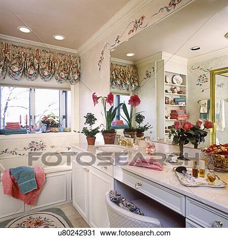 BATHROOMS: Tub, vanity with sink and wall mirror. Creamy/floral. View Large Photo Image Stock Image - BATHROOMS: Tub, vanity with sink and wall mirror. Creamy/floral. . Fotosearch