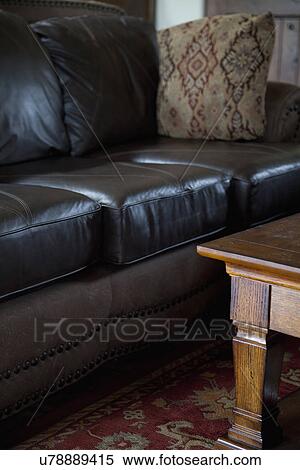 Black leather sofa and wooden coffee table; Porterville; California; USA View Large Photo Image Stock Photography - Black leather sofa and wooden coffee table; Porterville; California; USA. Fotosearch