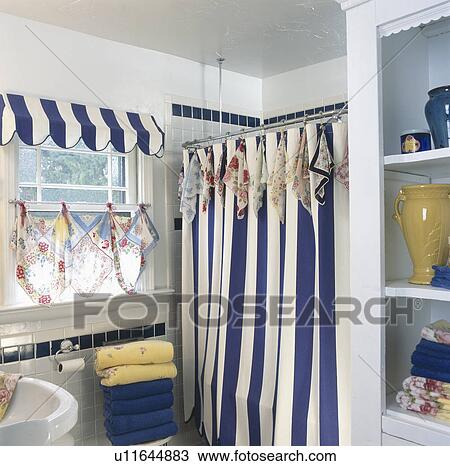 Blue and white striped shower curtain with vintage hankies as accents in domestic bathroom View Large Photo Image Stock Image - Blue and white striped shower curtain with vintage hankies as accents in domestic bathroom. Fotosearch