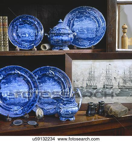 Blue transfer ware displayed on shelves View Large Photo Image Picture - Blue transfer ware displayed on shelves. Fotosearch