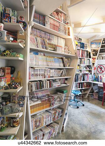 Books on floor to ceiling shelves in apartment View Large Photo Image Stock Image - Books on floor to ceiling shelves in apartment. Fotosearch