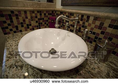 Stock Image - Bowl sink in bathroom; Seal Beach; California; USA. Fotosearch