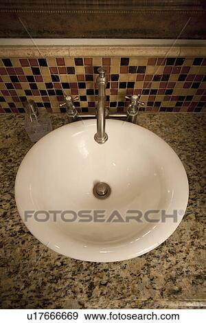 Stock Photo - Bowl sink in bathroom; Seal Beach; California; USA. Fotosearch