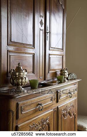 Stock Image - Brown wooden china cabinet; Carpinteria; California; USA. Fotosearch