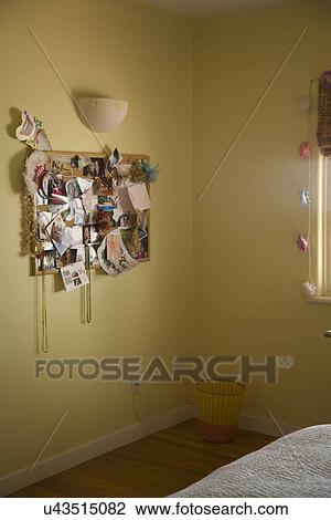 Bulletin board on yellow wall in teenagers bedroom; Carpinteria; California; USA View Large Photo Image Stock Image - Bulletin board on yellow wall in teenagers bedroom; Carpinteria; California; USA. Fotosearch
