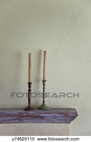 Stock Photography - Candlesticks on mantle; Victorville; California; USA. Fotosearch