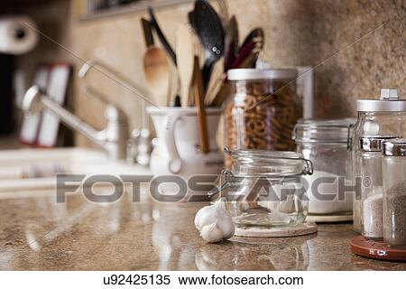 Stock Photography - Canisters of spices on countertop; Burbank; California; USA. Fotosearch