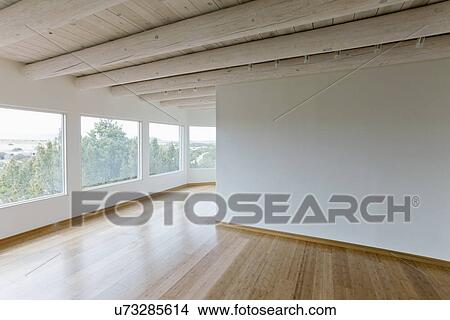 Ceiling Beams And Hardwood Floor In Home With Scenic Views