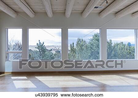 Stock Photography - Ceiling beams and hardwood floor in home with scenic views, Santa Fe, New Mexico, USA. Fotosearch