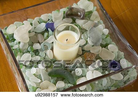 Centerpiece with candle and colorful smoothed glass; Carpinteria; California; USA View Large Photo Image Stock Photo - Centerpiece with candle and colorful smoothed glass; Carpinteria; California; USA. Fotosearch