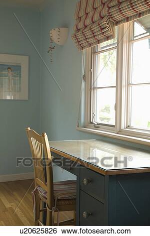 Chair and desk beneath window; Carpinteria; California; USA View Large Photo Image Stock Photograph - Chair and desk beneath window; Carpinteria; California; USA. Fotosearch