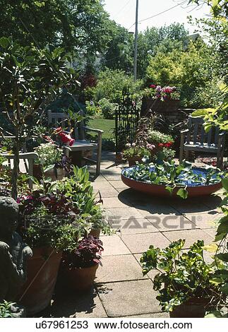 Chairs in garden View Large Photo Image Stock Image - Chairs in garden. Fotosearch