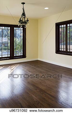 Stock Image - Chandelier hanging in empty room, Pasadena, California, USA. Fotosearch