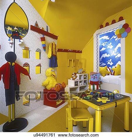 Children S Bedroom Bright Yellow And Red Room With Built In Features Bed Area Big Bird Yellow Table Designer Evie Zwetz Stock Image