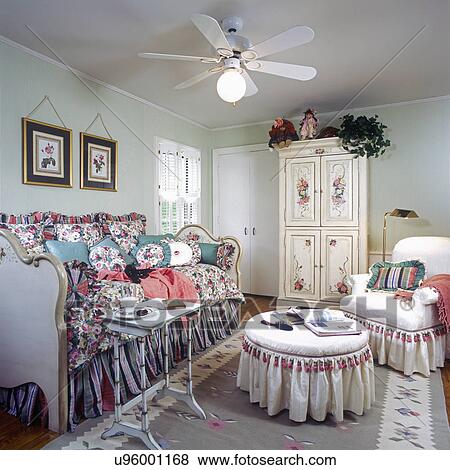 CHILDREN'S BEDROOM: Older girl's bedroom. Daybed with floral bedspread and pillows. Hand painted armoire. View Large Photo Image Stock Photo - CHILDREN'S BEDROOM: Older girl's bedroom. Daybed with floral bedspread and pillows. Hand painted armoire.. Fotosearch