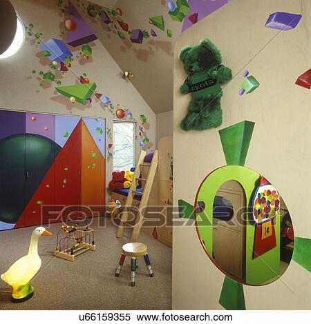 CHILDREN'S BEDROOMS: Young child's room with bright painted walls, playhouse, pencil stool. geometric shapes, goose lamp, ladder to bunk bed View Large Photo Image Stock Photography - CHILDREN'S BEDROOMS: Young child's room with bright painted walls, playhouse, pencil stool. geometric shapes, goose lamp, ladder to bunk bed. Fotosearch