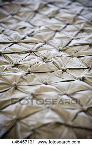 Stock Image - Close up detail contemporary satin bedspread; Aliso Viejo; California; USA. Fotosearch