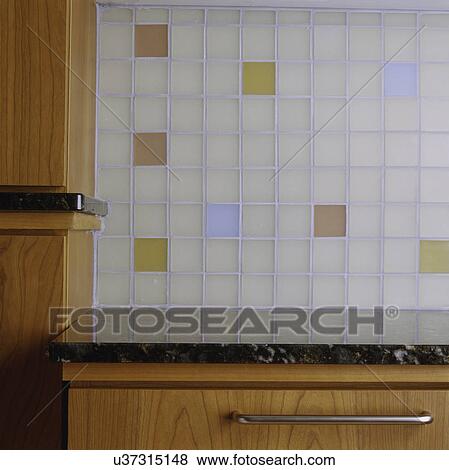 close up detail of color etched-glass tile mettle finish in pastel colors, drawer, granite counter top, and wood cabinets View Large Photo Image Stock Photo - close up detail of color etched-glass tile mettle finish in pastel colors, drawer, granite counter top, and wood cabinets. Fotosearch