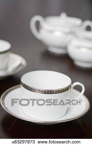 Close-up of an elegant coffee cup on saucer View Large Photo Image Stock Image - Close-up of an elegant coffee cup on saucer. Fotosearch