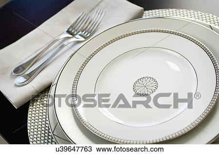 Close-up of an elegant place setting on dining table View Large Photo Image Stock Image - Close-up of an elegant place setting on dining table. Fotosearch