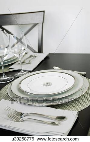 Close-up of an elegant place setting on dining table View Large Photo Image Stock Photograph - Close-up of an elegant place setting on dining table. Fotosearch