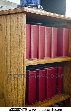 Close-up of books in shelf View Large Photo Image Stock Photo - Close-up of books in shelf. Fotosearch