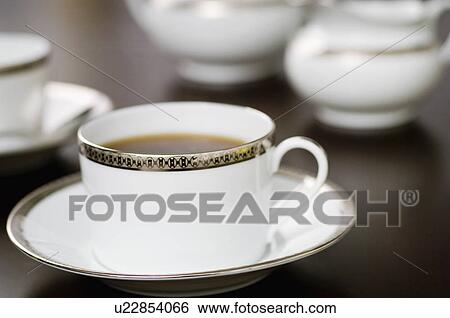 Close-up of cup of coffee on saucer View Large Photo Image Stock Photograph - Close-up of cup of coffee on saucer. Fotosearch