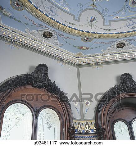 Stock Photo - Close-up of designed ceiling and glass window. Fotosearch