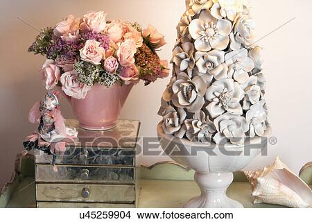 Picture - Close-up of flower vase sculpture with seashell. Fotosearch