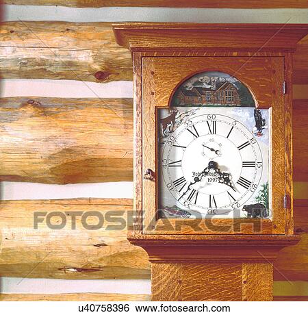 Close-up of grandfather's clock in wooden case against log wall View Large Photo Image Stock Photograph - Close-up of grandfather's clock in wooden case against log wall. Fotosearch