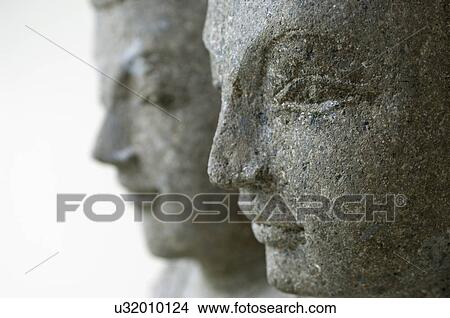 Picture - Close-up of statues isolated over white background. Fotosearch